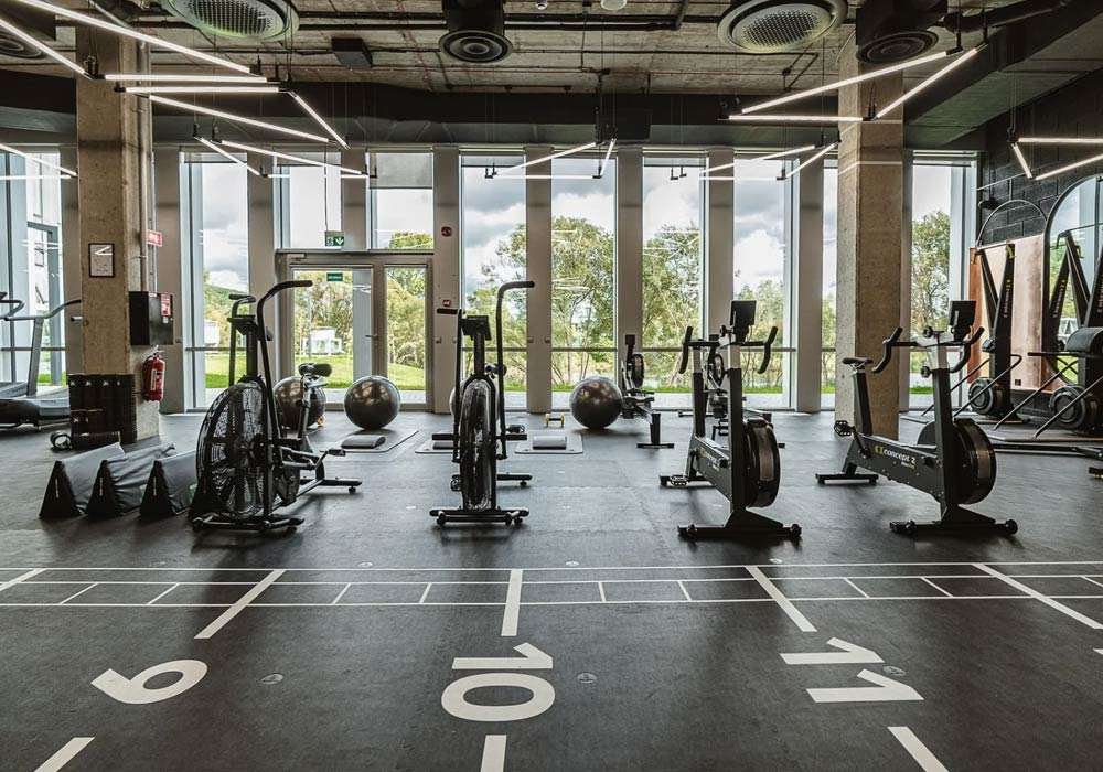 Premium commercial gym flooring designed for heavy impact and functional training.. Source: Stronger Wellness UK